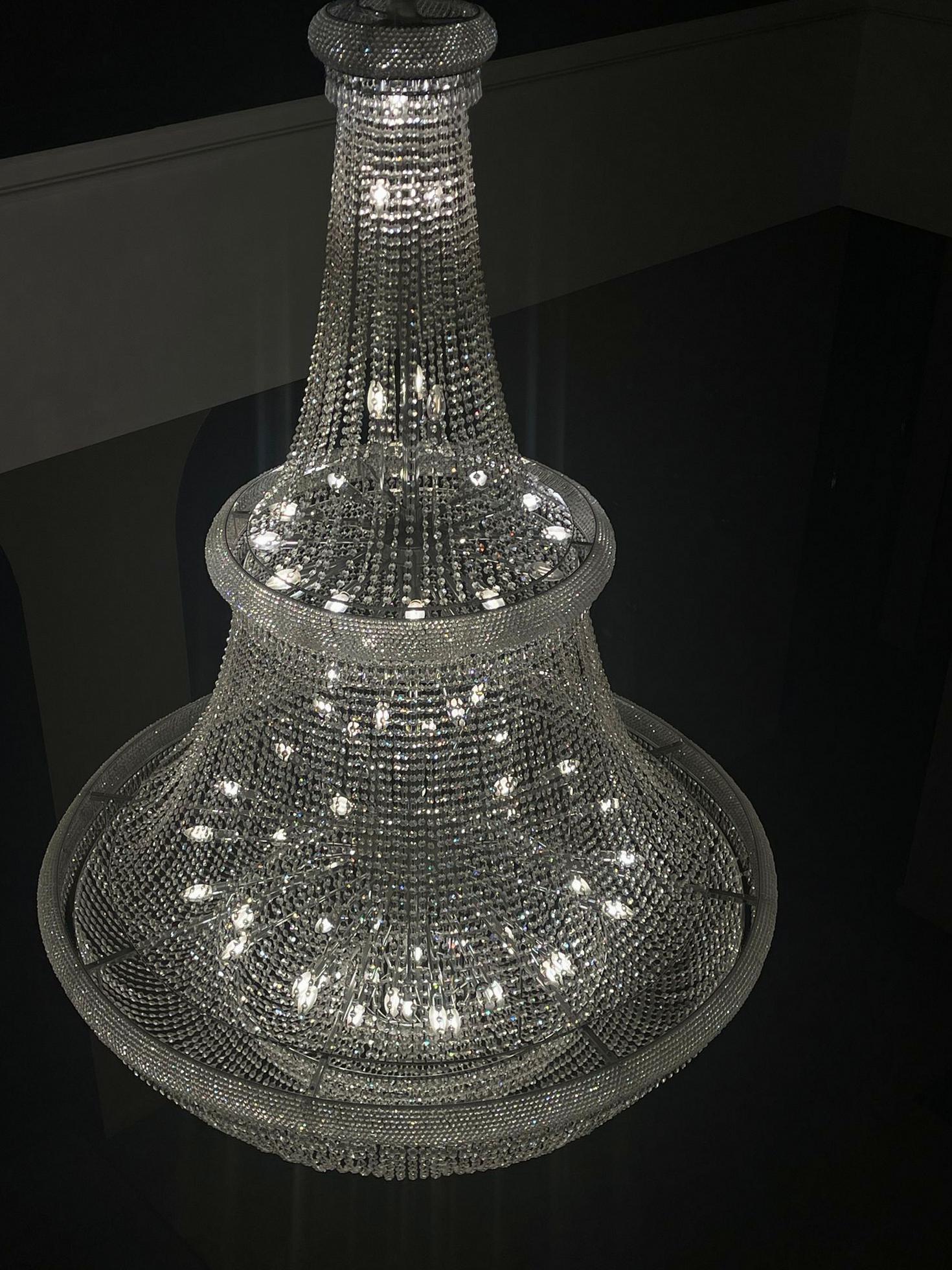 Exquisite crystal chandelier in a high-ceiling foyer